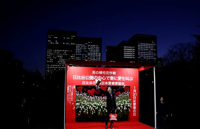 A man shouts to express his love to his wife on a stage at an annual event organized for men shouting their love to their wives or girlfriends publicly at a park in Tokyo, Japan, January 25, 2017. (Photo by Kim Kyung-Hoon/Reuters)
