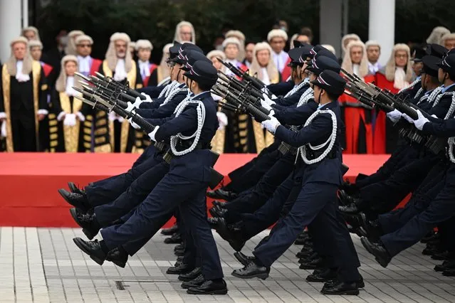 Hong Kong police goose step past judges to mark the opening of the legal year in Hong Kong on January 22, 2024. (Photo by Peter Parks/AFP Photo)