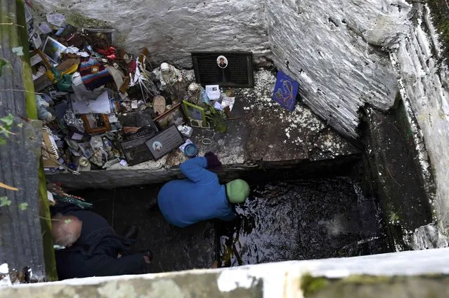 A man bends down to drink water from the holy well of St. Brigid on a Pattern Day pilgrimage to St. Brigid in Liscannor, Ireland February 1, 2017. (Photo by Clodagh Kilcoyne/Reuters)