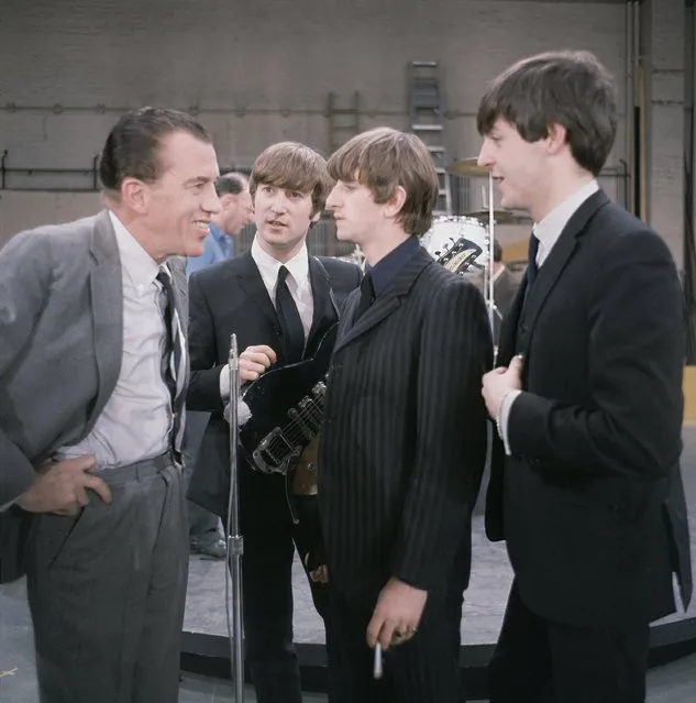 The British rock and roll group the Beatles talk to Ed Sullivan at CBS Studio 50 before their live television appearance on “The Ed Sullivan Show” in New York, February 10, 1964. From left to right are, Sullivan, John Lennon, Ringo Starr, holding a cigarette, and Paul McCartney. (Photo by AP Photo)