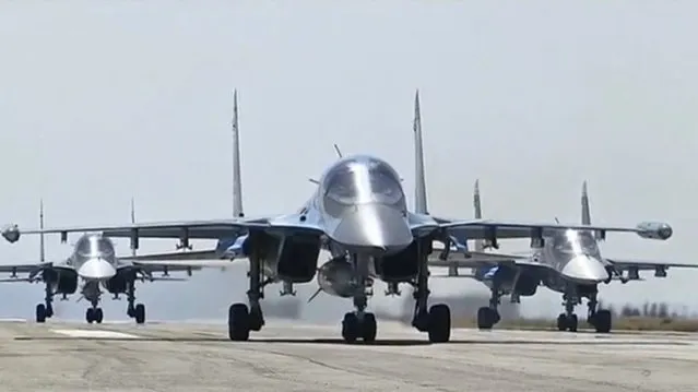 Russian military jets take off from the country's air base in Hmeymin, Syria to head back to Russia, part of a partial withdrawal ordered by President Vladimir Putin, in this still image taken from video March 15, 2016. (Photo by Reuters/Russian Ministry of Defence)