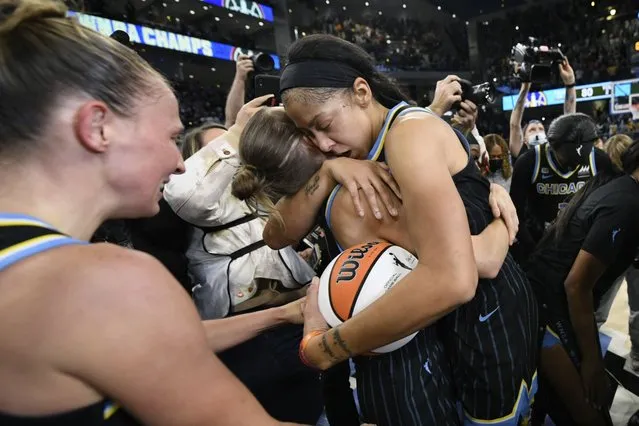 Chicago Sky's Candice Parker right, and Allie Quigley left, celebrate after defeating the Phoenix Mercury 80-74 in Game 4 of the WNBA Finals to become the 2021 WNBA champions Sunday, October 17, 2021, in Chicago. (Photo by Paul Beaty/AP Photo)