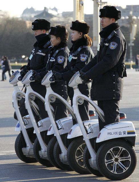 Police officers on segways are deployed to Tiananmen Square for the opening of the Second Session of the 12th National People's Congress (NPC) at the Great Hall of the People in Beijing, China, 05 March 2014. The NPC has over 3,000 delegates and is the world's largest parliament or legislative assembly though its function is largely as a formal seal of approval for the policies fixed by the leaders of the Chinese Communist Party. (Photo by Rolex Dela Pena/EPA)