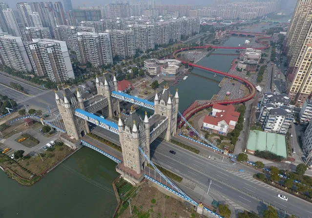 This photo taken on February 25, 2017 shows a bridge modeled on London' s Tower Bridge, in Suzhou, in China' s eastern Jiangsu province The bridge features four 40 meter tall towers instead of two, but otherwise uses many design elements from the London original. (Photo by AFP Photo/Stringer)