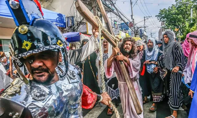 A group reenacts in the streets the sufferings of Jesus in Antipolo City on March 29, 2024. The Senakulo is a dramatic depiction of the life, suffering, death, and resurrection of Jesus Christ. It is also known as the passion play or cenaculo. (Photo by Ryan Eduard Benaid/SOPA Images/Rex Features/Shutterstock)