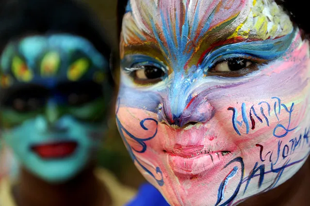 Indian students pose with their faces painted at a college in Chennai on March 7, 2017, ahead of International Women's Day. (Photo by Arun Sankar/AFP Photo)