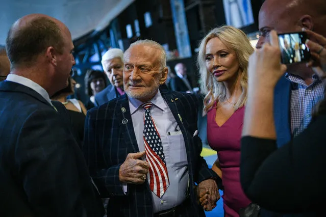 Former NASA astronaut Buzz Aldrin makes his entrance makes his entrance with girlfriend Anca Faur at an Apollo 11 anniversary celebration dinner at the Davidson Center for Space Exploration o July 17, 2019, at the US Space & Rocket Center in Huntsville, Alabama. (Photo by Loren Elliott/AFP Photo)