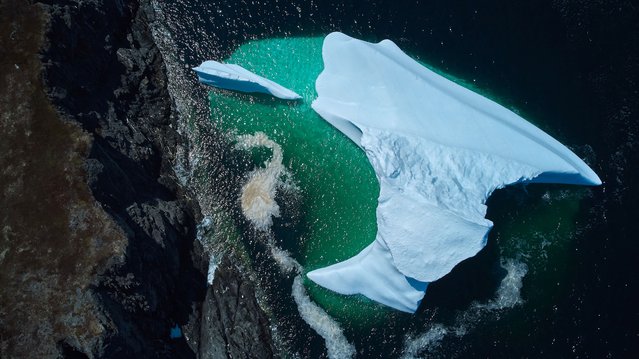 An iceberg that drifted south on the Labrador Sea from Greenland is now grounded in Saint Lunaire-Griquet, Newfoundland, Canada, on May 27, 2024. (Photo by Greg Locke/Reuters)