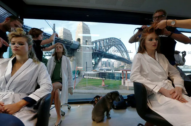 Models have their hair styled at a salon alongside the Sydney Harbour Bridge before the Manning Cartel catwalk show at Australian Fashion week, May 17, 2016. (Photo by Jason Reed/Reuters)