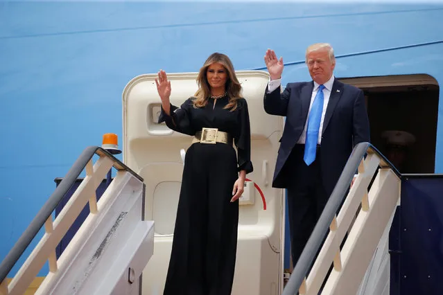 U.S. President Donald Trump and first lady Melania Trump wave as they arrive in Riyadh, Saudi Arabia, May 20, 2017. (Photo by Jonathan Ernst/Reuters)