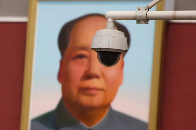 A security camera is attached to a pole in front of the portrait of former Chinese Chairman Mao Zedong on Beijing's Tiananmen Square, China May 19, 2017. (Photo by Thomas Peter/Reuters)