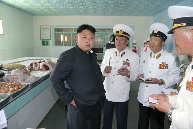 North Korean leader Kim Jong Un (L) gives field guidance during his inspection of the Korean People's Army (KPA) Naval Unit 167 in this undated photo released by North Korea's Korean Central News Agency (KCNA) in Pyongyang June 16, 2014. (Photo by Reuters/KCNA)
