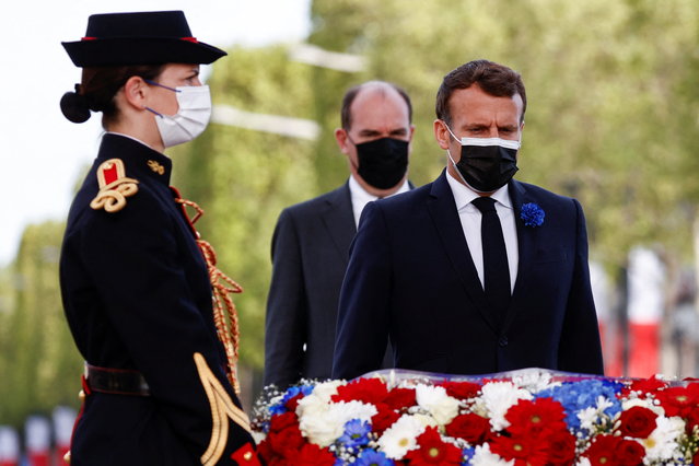 French President Emmanuel Macron and French Prime Minister Jean Castex attend a ceremony marking the 76th anniversary of Victory in Europe (VE-Day), marking the end of World War II in Europe, in Paris on May 8, 2021. The leader of the Free French Forces, Charles de Gaulle, announced the official end of World War II to the French people on May 8, 1945, marking the end of a six-year war and the Nazi oppression in France, which resulted in millions of deaths. (Photo by Christian Hartmann/Pool via AFP Photo)