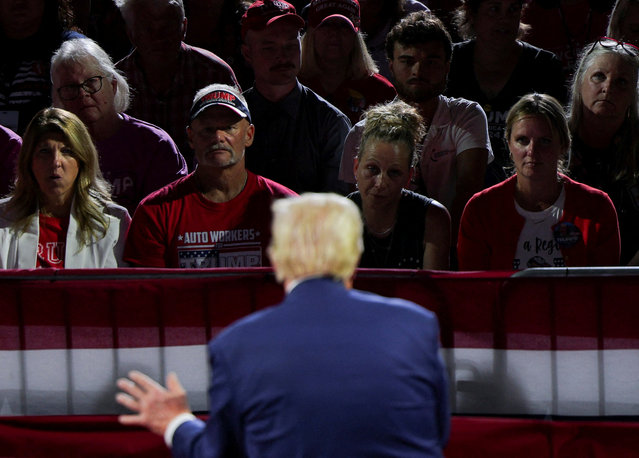 Supporters listen as Republican presidential nominee and former U.S. President Donald Trump speaks during a campaign town hall meeting, moderated by Arkansas Governor Sarah Huckabee Sanders, in Flint, Michigan on September 18, 2024. (Photo by Brian Snyder/Reuters)