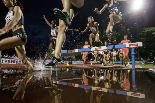 Athlets run during the women's 3000 meter steeplechase at the International Athletics Meeting in Lucerne, Switzerland, 14 June 2016. (Photo by Alexandra Wey/EPA)