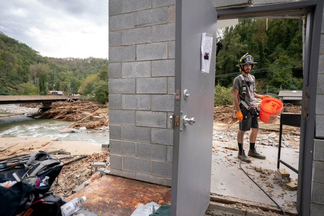 Avery Sherrill salvages what he can from his destroyed family business, Mudtools, along the Broad River in the aftermath of Hurricane Helene on October 1, 2024 in Bat Cave, North Carolina. The death toll has topped 140 people across the southeastern U.S. due to the storm, according to published reports, which made landfall as a category 4 storm on Thursday. Millions are without power and the federal government has declared major disasters in areas of North Carolina, Florida, South Carolina, Tennessee, Georgia, Virginia and Alabama, freeing up federal emergency management money and resources for those states, according to the reports. (Photo by Sean Rayford/Getty Images)