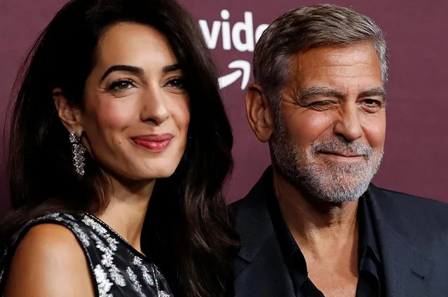 Director George Clooney and his wife lawyer Amal Clooney attend a tastemaker screening of the film “The Tender Bar” at Directors Guild of America in Los Angeles, California, U.S., October 3, 2021. (Photo by Mario Anzuoni/Reuters)