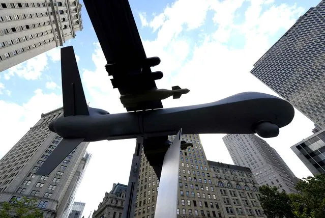 A model of a drone on display as New Yorkers gather to protest Israel’s military assault in Gaza during a rally at Foley Square July 24, 2014 where they will read aloud over hundred names of the Palestinian children that killed in Israel’s assault, before march through lower Manhattan. (Photo by Timothy A. Clary/AFP Photo)