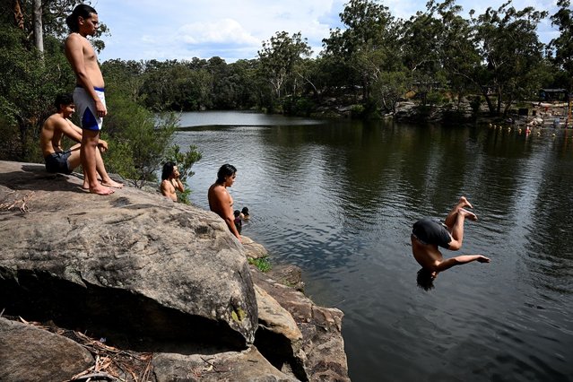 People cool off at Lake Parramatta, west of Sydney, Australia, 27 November 2024. (Photo by Dan Himbrechts/EPA)