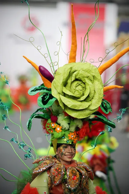 A model showcases a design on the catwalk during the eighth Jember Fashion Carnival on August 2, 2009 in Jember, East Java, Indonesia. (Photo by Ulet Ifansasti/Getty Images)