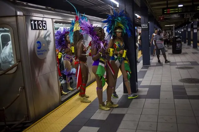 Participants walk out of a train as they arrive for the West Indian Day Parade in the Brooklyn borough of New York September 1, 2014. (Photo by Eric Thayer/Reuters)