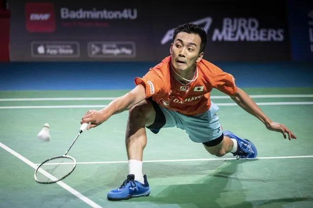 Kenta Nishimoto of Japan hits a return against Chou Tien-chen of Taiwan during the men's singles final on day six of the Japan Open badminton tournament in Osaka on September 4, 2022. (Photo by Yuichi Yamazaki/AFP Photo)
