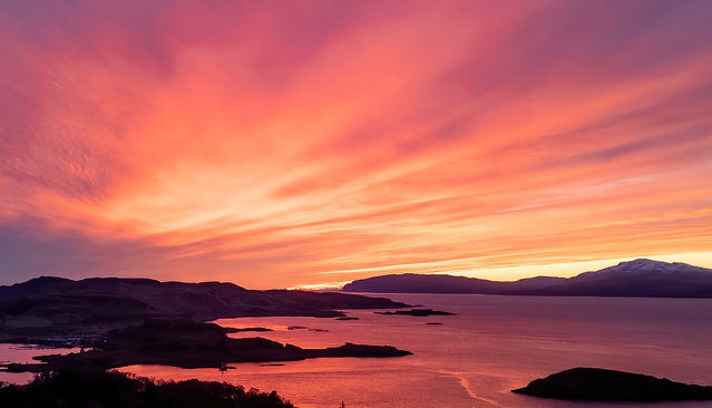 A spectacular sunset this evening from Oban, Argyll turned the sea as well as the sky red on January 5, 2025. (Photo by Stephen Lawson/Sipa USA)