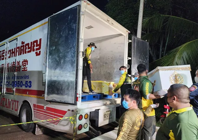 A handout photo made available by Ruamkatanyu Foundation shows Ruamkatanyu Foundation's rescue workers loading into a truck the coffins containing the mass shooting victims at a childcare center in Nong Bua Lamphu province, northeastern Thailand, 06 October 2022. According to Deputy National Police Chief Pol Lt Gen Torsak Sukvimol, at least 35 people, mostly children, were killed when a former policeman carried out a mass shooting at a children care center before killing himself, his wife and their child. (Photo by Ruamkatanyu Foundation/EPA/EFE)