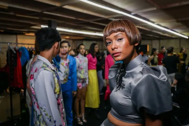 A model poses for a photo at the backstage of a fashion show by Bent during Kuala Lumpur Fashion Week 2022 on August 17, 2022 in Pavilion, Kuala Lumpur, Malaysia. The annual fashion showcase has set out to create a platform where Malaysian designers are able to highlight their work. This year marks the 10th anniversary celebrating the Malaysian fashion industry. (Photo by Annice Lyn/Getty Images)