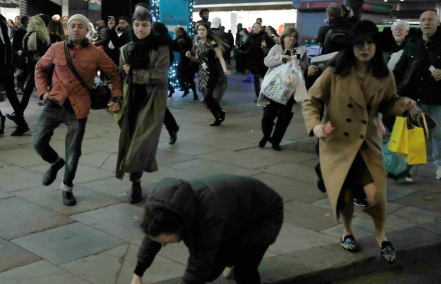A woman stumbes as people run down Oxford Street, London, Britain, November 24, 2017. (Photo by Peter Nicholls/Reuters)