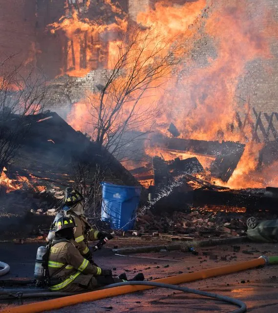 Firefighters from around the region work to control a multi-structure fire on Thursday, November 30, 2017 in Cohoes, N.Y. The blaze broke out Thursday afternoon in downtown Cohoes, just north of Albany, and was stoked by 20 to 30 mph winds. Three buildings were destroyed, 18 others were damaged and at least 20 people were displaced. The city is under a state of emergency. (Photo by Skip Sickstein/The Albany Times Union via AP Photo)