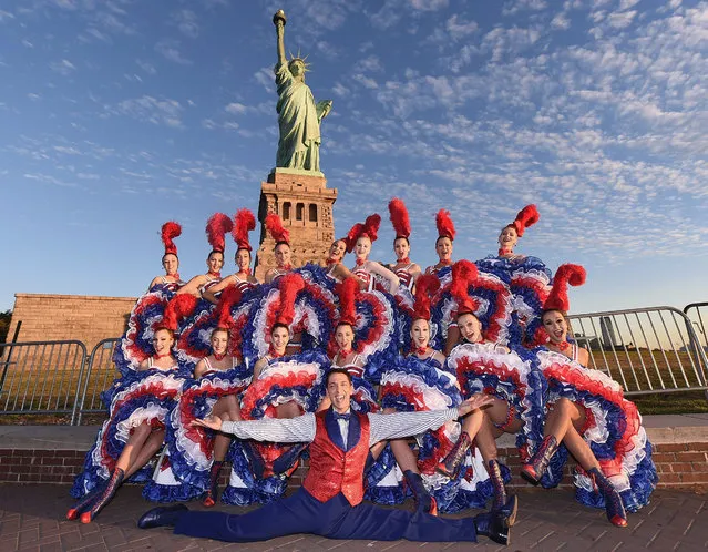 Moulin Rouge Dancers visit The Statue of Liberty on September 23, 2015 in New York City. This stop was part of Moulin Rouge's first visit to New York City in its history. (Photo by Michael Loccisano/Getty Images)