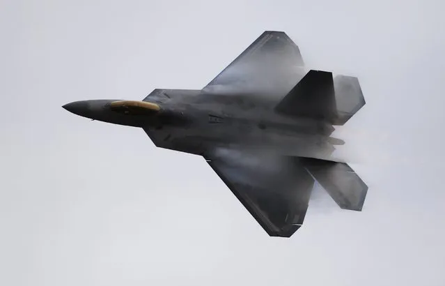 A U.S. Air Force F-22 Raptor fighter jet piloted by Major John Cummings performs maneuvers during the California International Airshow in Salinas, California, September 27, 2015. (Photo by Michael Fiala/Reuters)