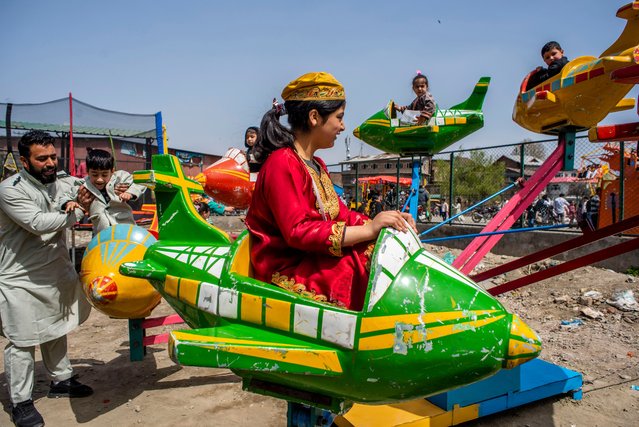 Kashmiri children enjoy amusement ride during Eid-al-fitr, a festival celebrated by Muslims worldwide on March 31, 2025 in Srinagar, India. Eid al-Fitr is an Islamic festival marking the end of Ramadan, celebrated worldwide with prayers, family gatherings, feasts, and acts of charity. (Photo by Yawar Nazir/Getty Images)