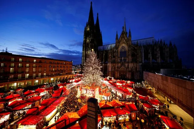A general view of the Christmas market on the square in front of the world famous gothic cathedral in Cologne, Germany, November 28, 2017. (Photo by Thilo Schmuelgen/Reuters)