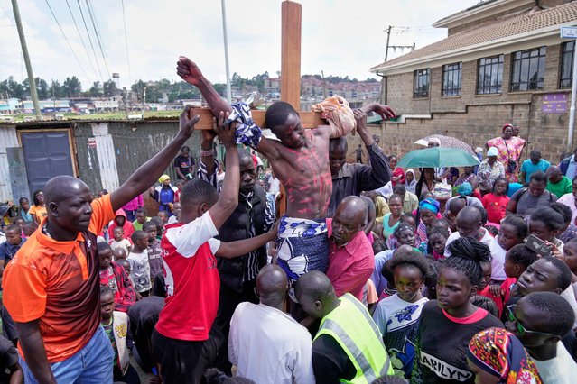 Christians reenact the crucifixion of Jesus Christ in a Way of the Cross procession on Good Friday during Holy Week in the informal settlement of Kibera in Nairobi, Kenya, Friday, April 18, 2025. (Photo by Brian Inganga/AP Photo)