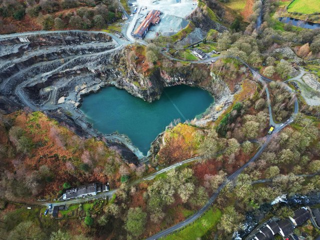 A hidden heart shape is revealed at the Elterwater Quarry in the Lake District after water levels dropped, exposing the romantic geographical feature filled with turquoise water caused by the chemical compounds in the 500-year-old volcanic rock. Picture date: Monday February 12, 2024. (Photo by Owen Humphreys/PA Wire)