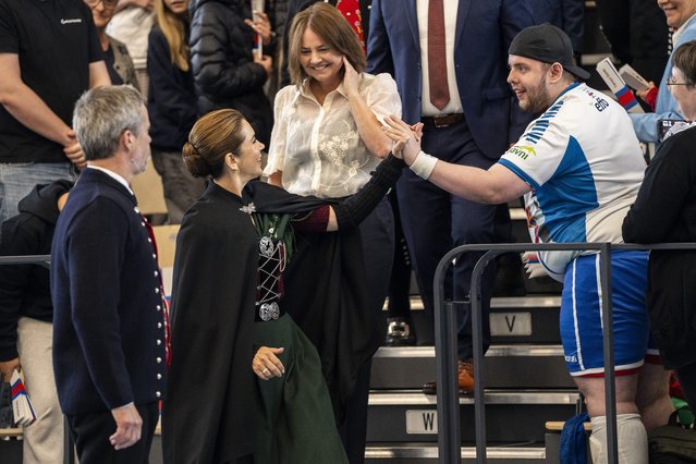 King Frederik X (L), and Queen Mary (2-L), visit the multi-hall at Tjarnir in Torshavn in the Faroe Islands 11 June 2025. The multi-hall, which is used for handball training and matches, opened in 2025. The Danish Royal Couple started their first official visit to the Faroe Islands from June 11-13. During the visit, they will tour several different towns and areas of the North Atlantic islands. (Photo by Ida Marie Odgaard/EPA/EFE)