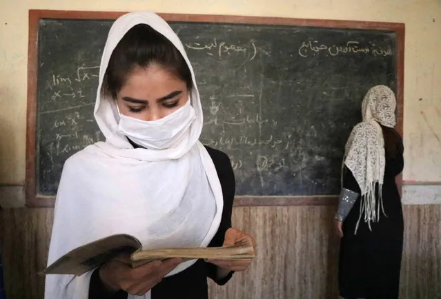 Afghan student girls attend the second day of their school after the educational institutes opened in Herat, Afghanistan, 23 August 2020. Schools reopen across Afghanistan, in a trial following months of closure due to the pandemic. (Photo by Jalil Rezayee/EPA/EFE)