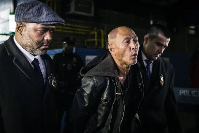 Weng Sor is walked by New York Police Department detectives out of the 68th Precinct in the Brooklyn borough of New York on Tuesday, February 14, 2023. Sor was charged Tuesday with murder and attempted murder after he went on a deadly rampage with a U-Haul truck a day earlier in New York City. (Photo by Stefan Jeremiah/AP Photo)