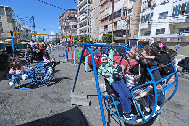 Children play on the amusement equipment, enjoying the festive atmosphere on the first day of Eid al-Fitr in Beirut, Lebanon, on March 30, 2025. (Photo by Xinhua News Agency/Rex Features/Shutterstock)