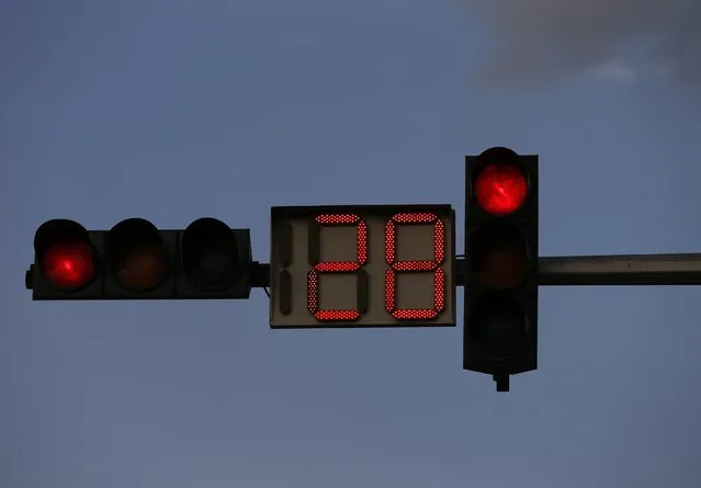 A red traffic light counts down on a street in Kabul August 31, 2014. (Photo by Mohammad Ismail/Reuters)