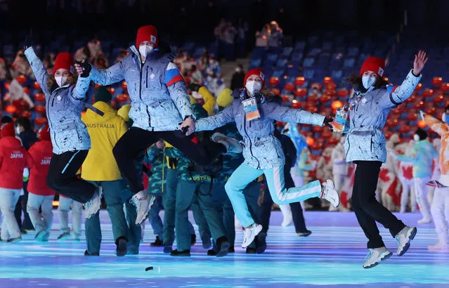 Athletes from the delegation of Russia's Olympic Committee (ROC) parade during the closing ceremony of the Beijing 2022 Winter Olympic Games, at the National Stadium, known as the Bird's Nest, in Beijing, on February 20, 2022. (Photo by Phil Noble/Reuters)