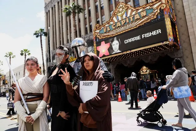 Fans pose on the day of the posthumous unveiling of the star of actor Carrie Fisher on the Hollywood Walk of Fame in Los Angeles, California, U.S., May 4, 2023. (Photo by Mario Anzuoni/Reuters)