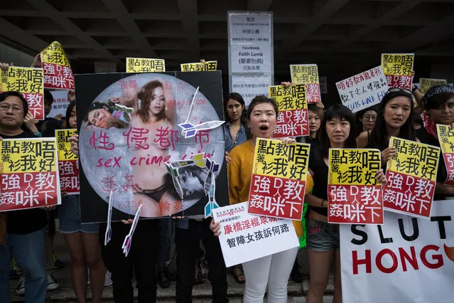 People display placards reading “Don' t teach me how to put clothes on, teach that man not to rape” during the fifth annual “SlutWalk” in Hong Kong on October 30, 2016, to protest against sеxual violence, victim blaming and rape culture The campaign, which has gained international notoriety, was inspired by a group of Canadian women who launched the protest in 2011 in response to a policeman' s comment that if women want to avoid being attacked they should not dress like sl*ts. (Photo by Dale de la Rey/AFP Photo)