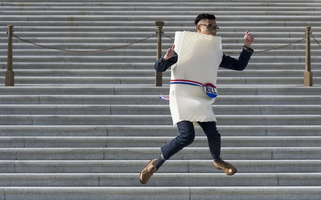 Rene T, who refused to provide his full last name, wears a “Bill on Capitol Hill” costume as he jumps in the air while a friend takes photos on the U.S. Senate steps at the U.S. Capitol on Monday, October 31, 2016. (Photo By Bill Clark/CQ Roll Call)