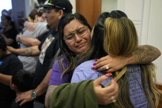 Family members of the victims of the Uvalde shootings react after a Texas House committee voted to take up a bill to limit the age for purchasing AR-15 style weapons in the full House in Austin, Texas, Monday, May 8, 2023. (Photo by Eric Gay/AP Photo)
