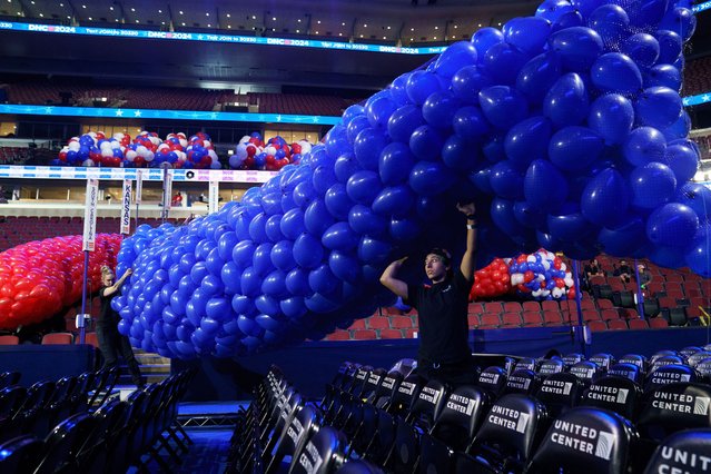 Workers prepare balloons inside the Democratic National Convention (DNC) vunue at the United Center, in Chicago, Illinois, USA, 15 August 2024. The Democratic National Convention will take place from 19 August until 22 August 2024. (Photo by Will Oliver/EPA)