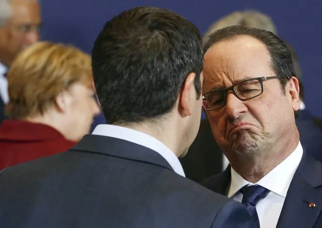 Greek Prime Minister Alexis Tsipras (L) talks with French President Francois Hollande before a group photo at an EU-Turkey summit, in which the EU seeks Turkish help to slow the influx of migrants into southeastern Europe, in Brussels, Belgium November 29, 2015. (Photo by Yves Herman/Reuters)