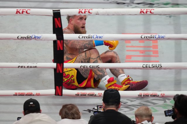 Jake Paul reacts on the canvas after being hit by Anthony Joshua during their heavyweight boxing match, Friday, December 19, 2025, in Miami, Fla. (Photo by Lynne Sladky/AP Photo)